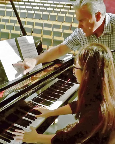 Allan teaching piano